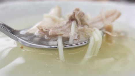 chicken soup in a white bowl