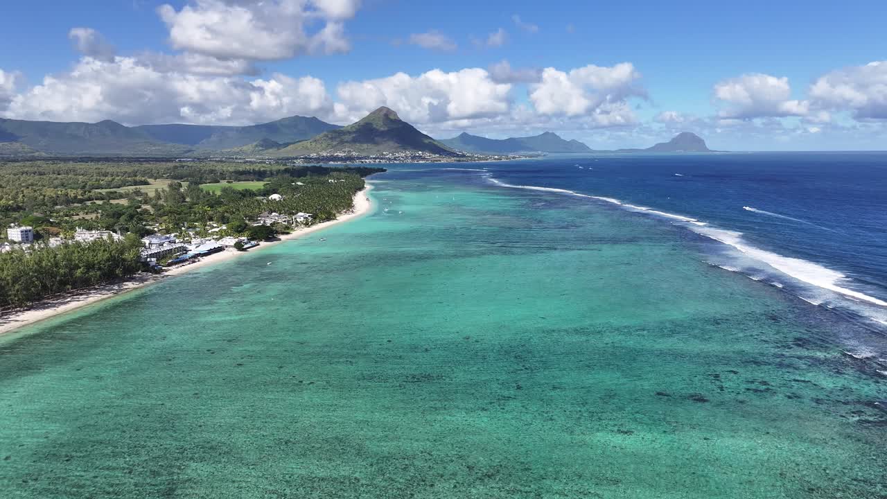 Aerial view of Mauritius coastline with mountains and turquoise ocean