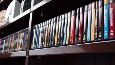 organized video game collection on shelves