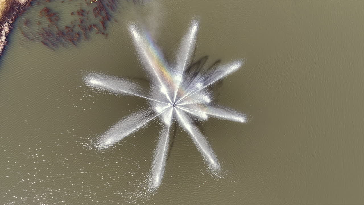 Aerial view top down of a fountain in a pond in Miami Florida