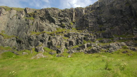 wide shot looking at the inland rocky cliff at dunskey street carpark, portpatrick