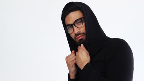 Man-in-hoodie-posing-against-white-background-4k