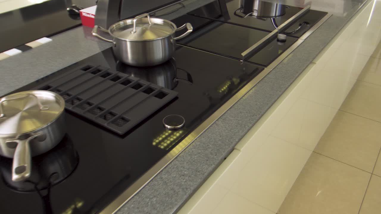 Modern Kitchen Cooktop with Pots and Pans