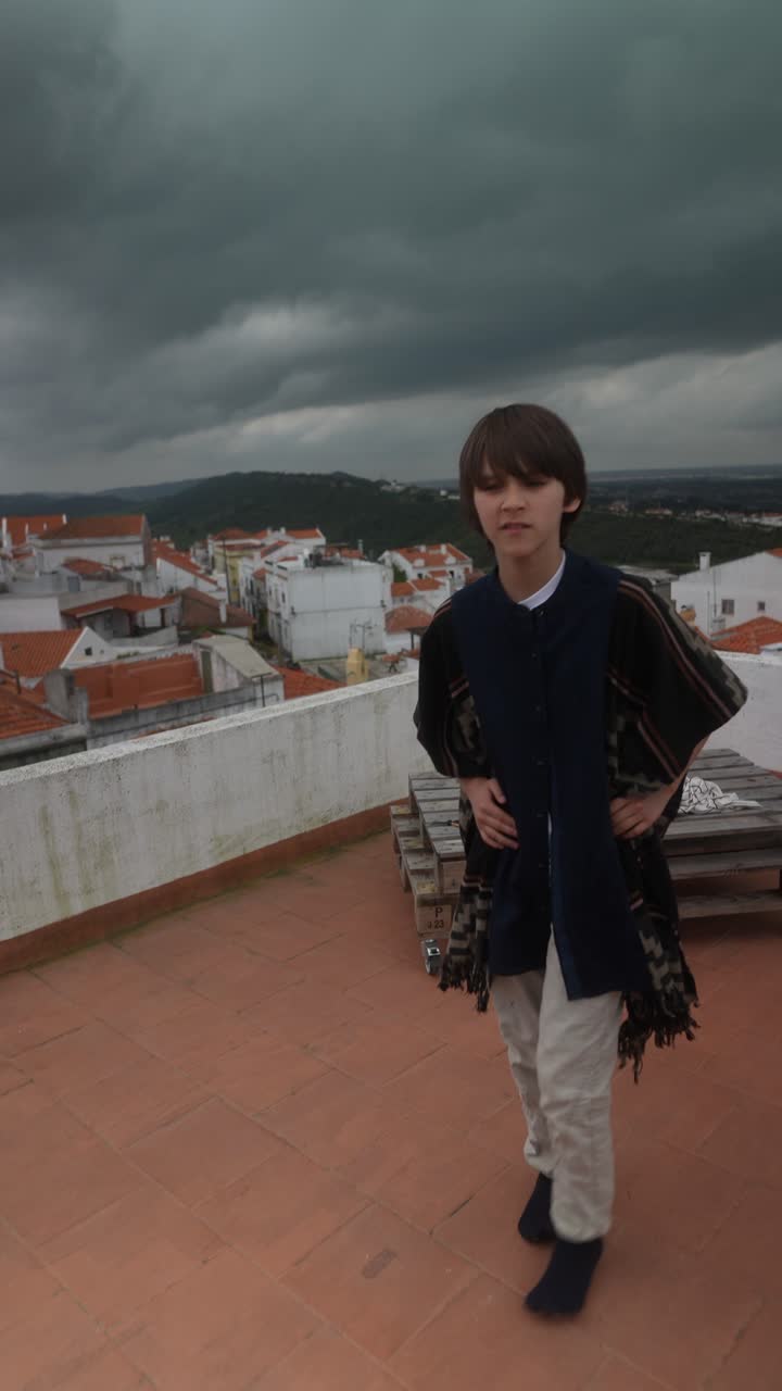 Boy on a rooftop during a storm