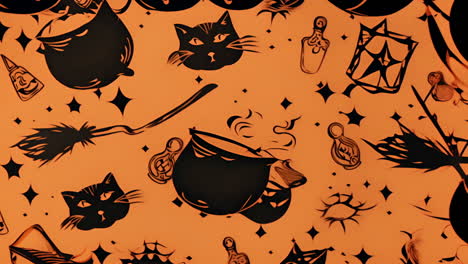 halloween-themed animation with black cats, cauldrons, and witch brooms over orange background