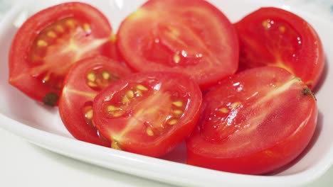 sliced tomatoes in a white bowl