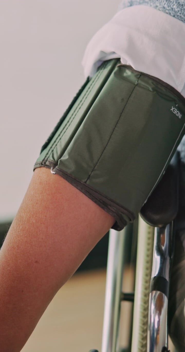 Senior Person Measuring Blood Pressure at Home