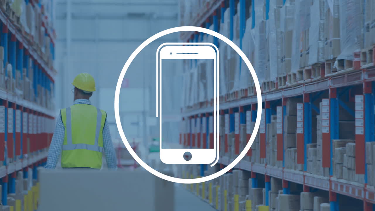 Animation of smartphone icon in circle over caucasian man working in warehouse