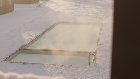 pool in the snowy backyard