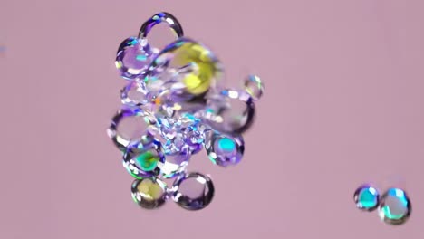 abstract video of floating translucent bubbles with colorful reflections, captured from a close-up