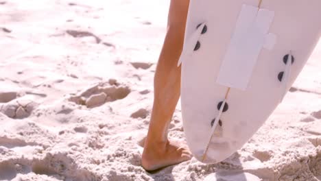 surfer walking with his board