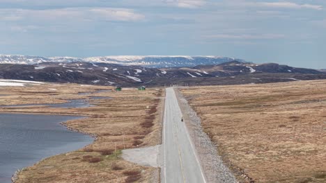 scenic route of national road 7 (rv7) through the hardangervidda national park in norway. aerial drone shot