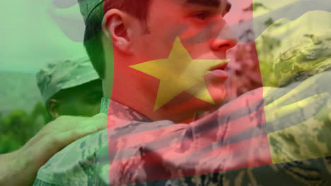 animation of flag of cameroon waving over diverse soldiers