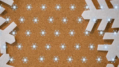 Animation-of-snowflakes-falling-on-golden-background