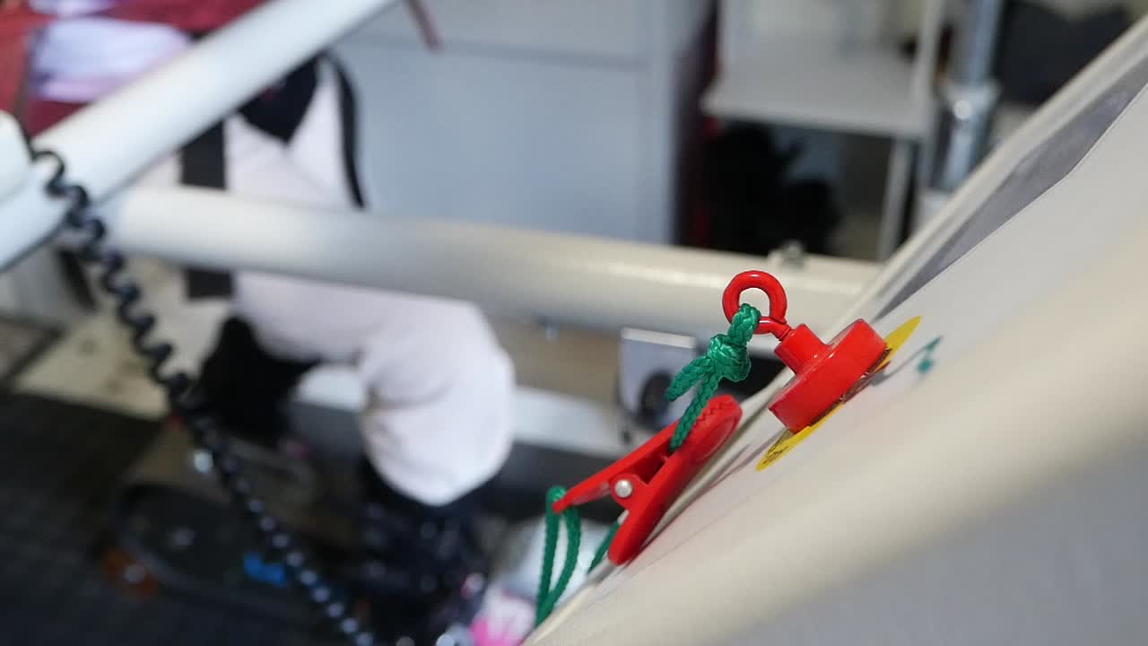 Close up of a clip attached to a button