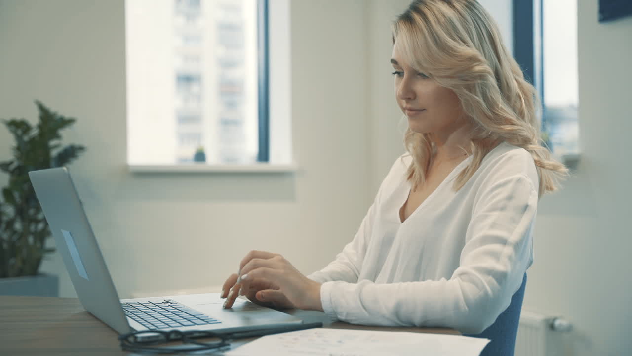 Pretty Young Blonde Business Woman Waving And Inviting To Enter