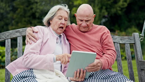 nature, tablet and senior couple on a bench