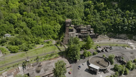 rusty material ropeway leading downhill to abandoned chiatura mine