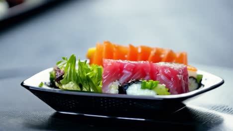 a delicious sushi and sashimi plate