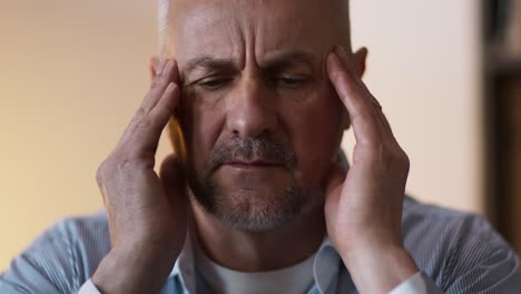 man experiencing headache