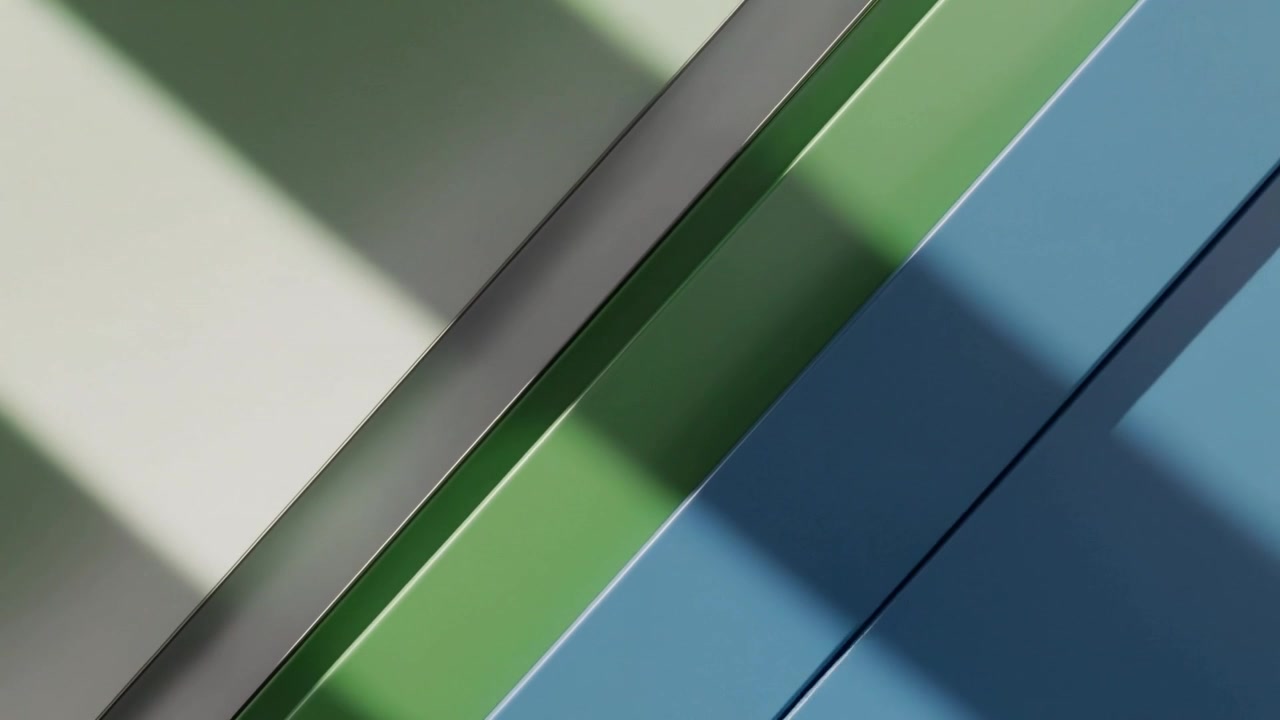 Luce mutevole che rivela un'ombra diagonale attraverso pannelli verdi e blu in un primo piano in studio, con una giuntura grigia.