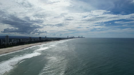 burleigh heads beach with surfers paradise skyline in the distance, aerial view