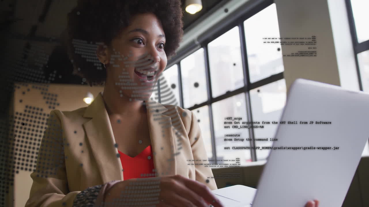 Animation of financial data processing over african american businesswoman using laptop