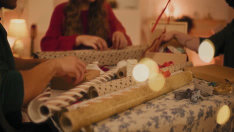 friends wrapping christmas presents together