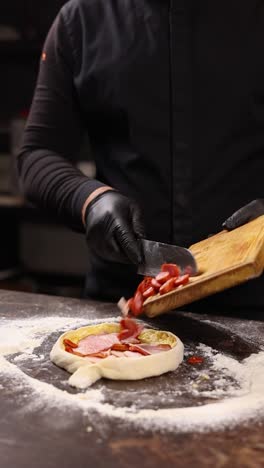 chef preparing a pizza