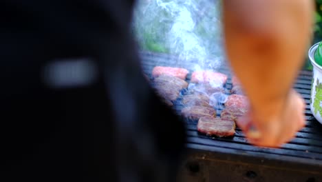 cooked meatballs are turning with tongs slow motion