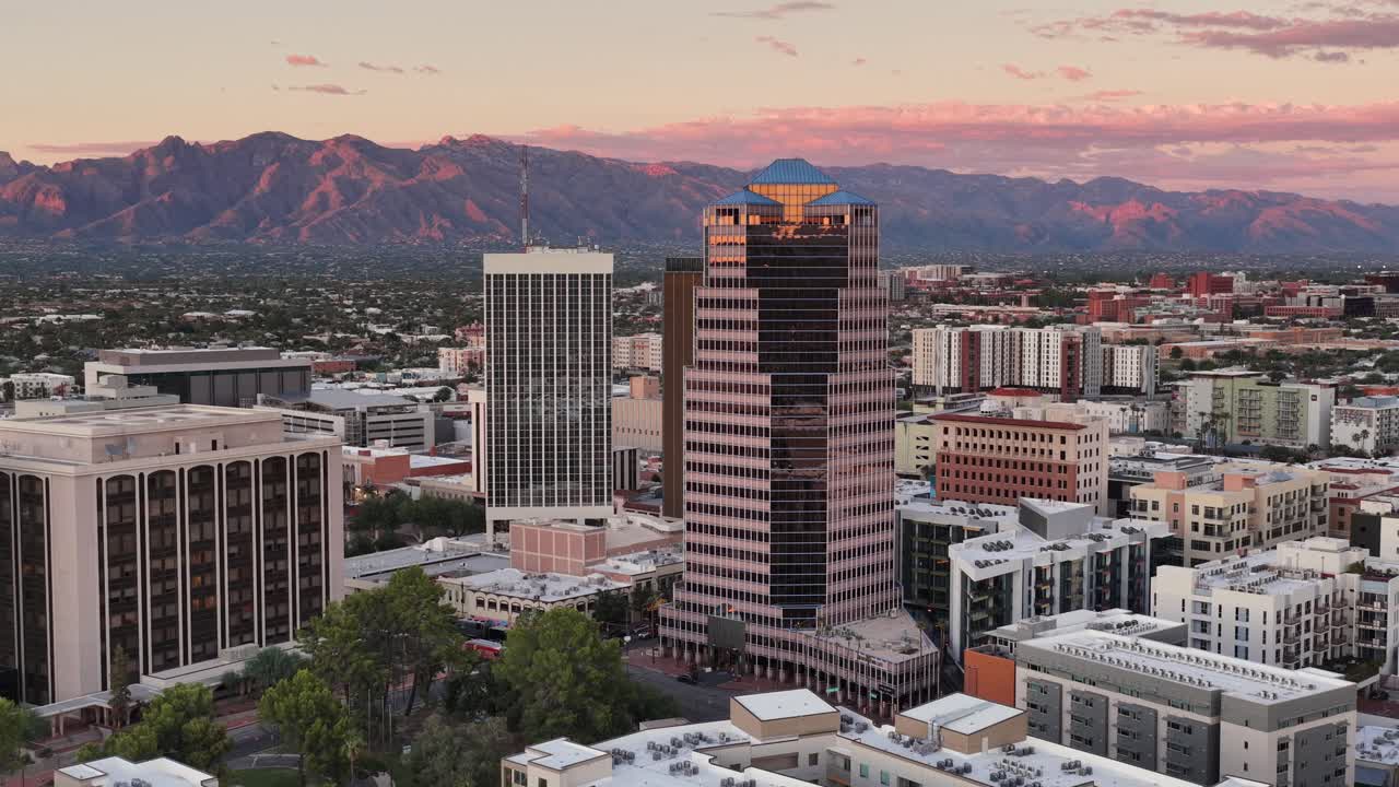 Ascending shot of One South Church in downtown Tucson, Arizona at sunset with Catalina Mountains in background