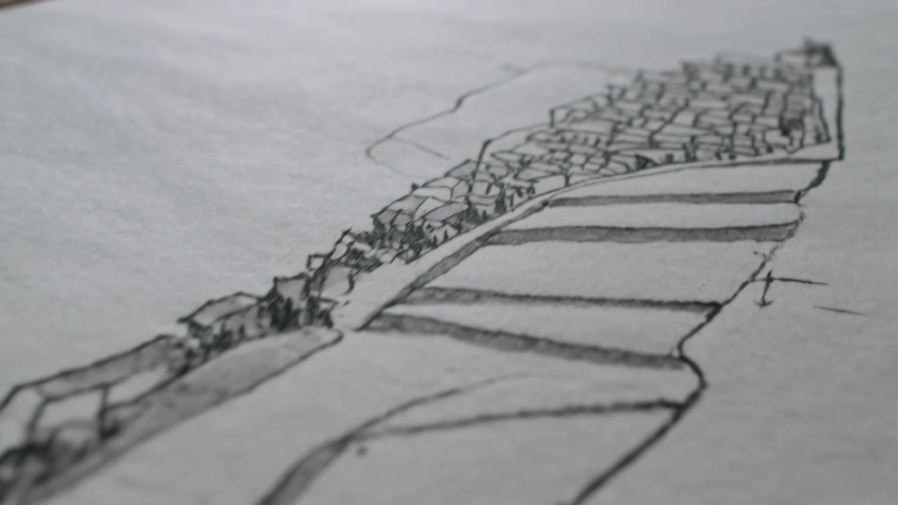 Revealing pencil drawing on textured sheet as camera tracking across desk, showing terraces, town
