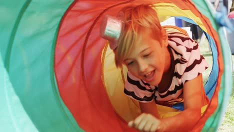 boy moving through tent tunnel 4k