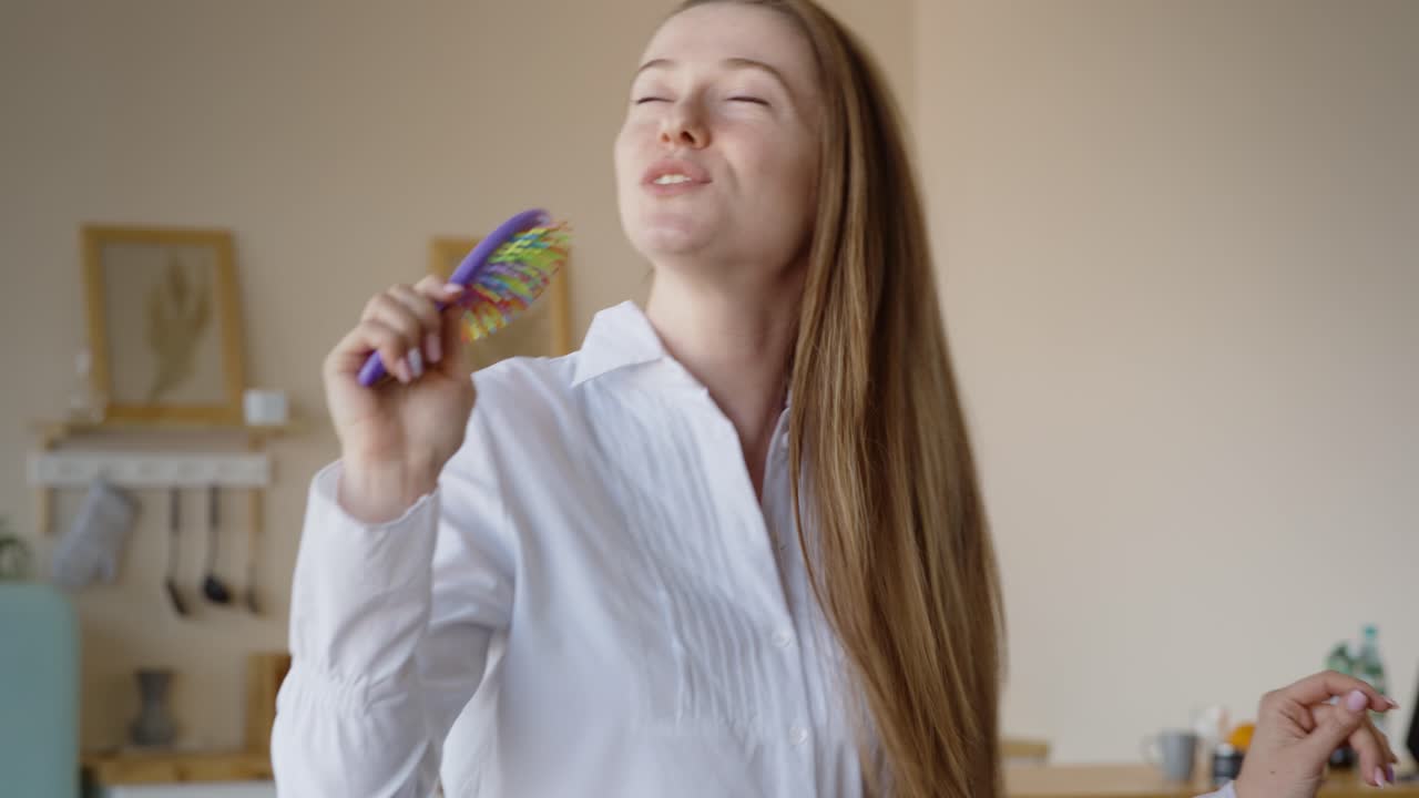Woman Singing with a Hairbrush