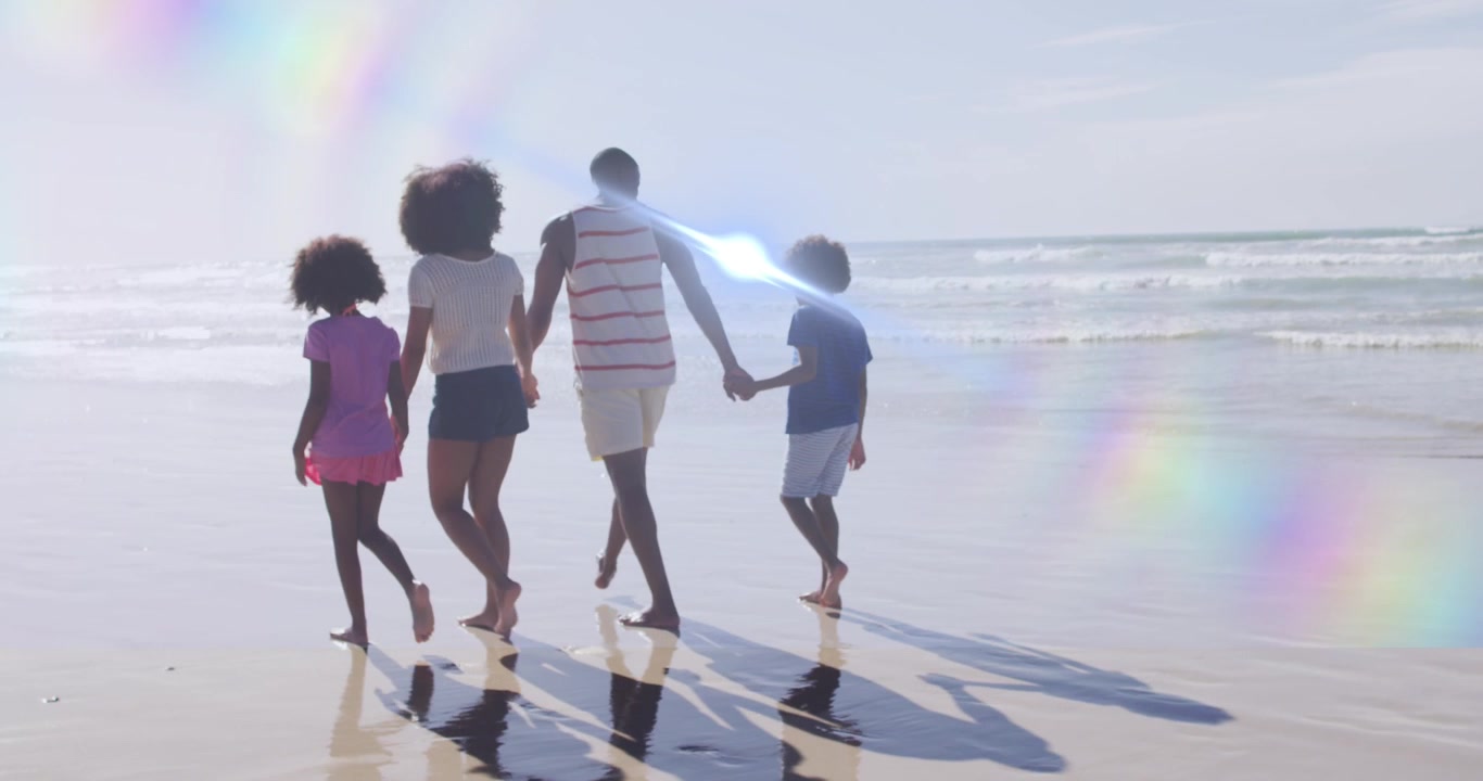Animation of light trails over african american family at beach