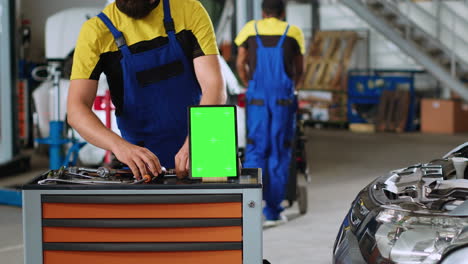 chroma key tablet in auto repair shop