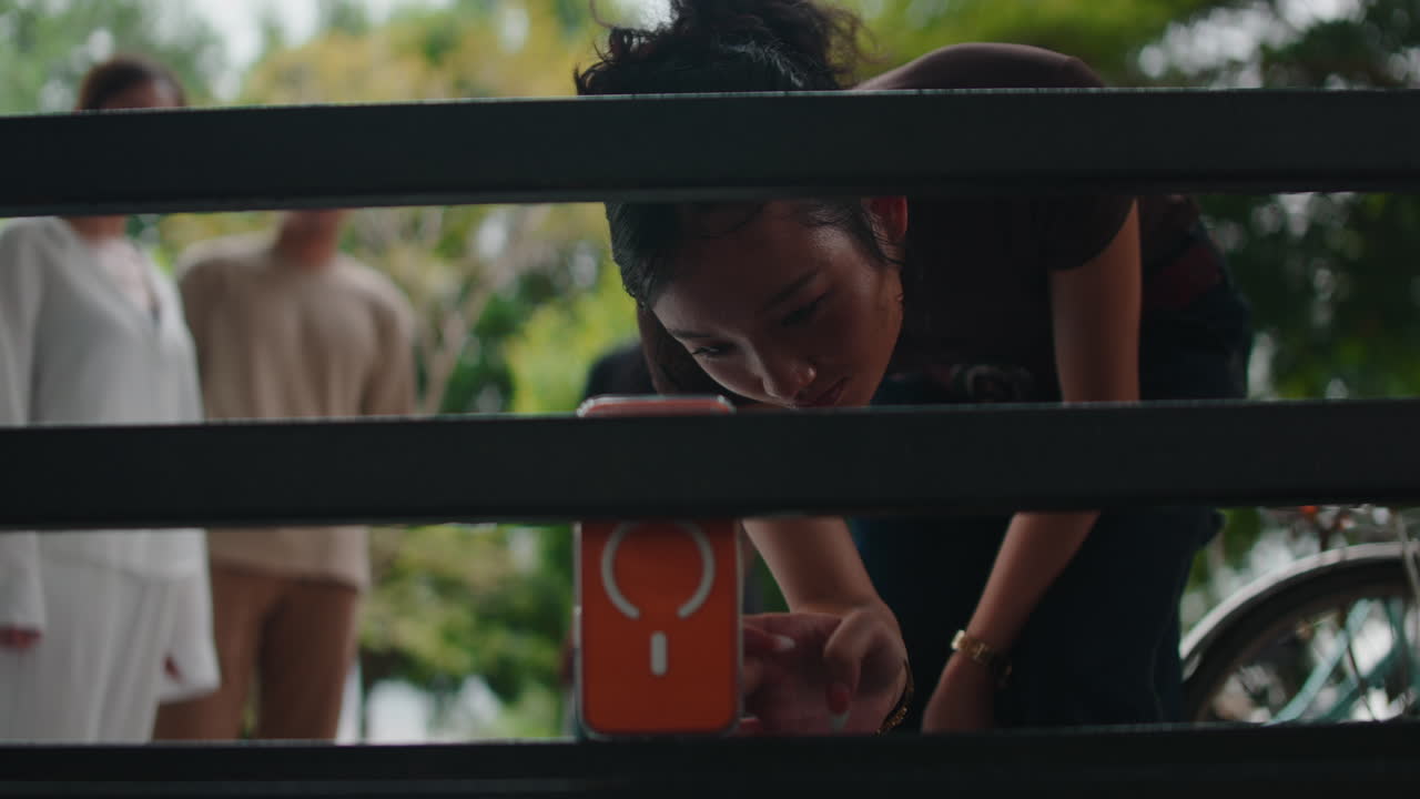 A woman using a mobile phone outdoors