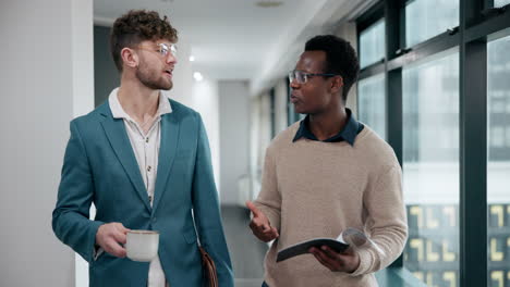 businessmen in office hallway