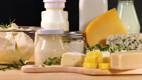 various dairy items arranged on a wooden board