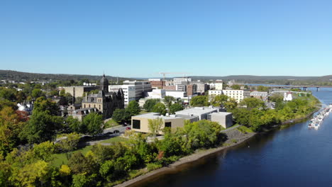 aerial: flying toward downtown fredericton on sunny summer day
