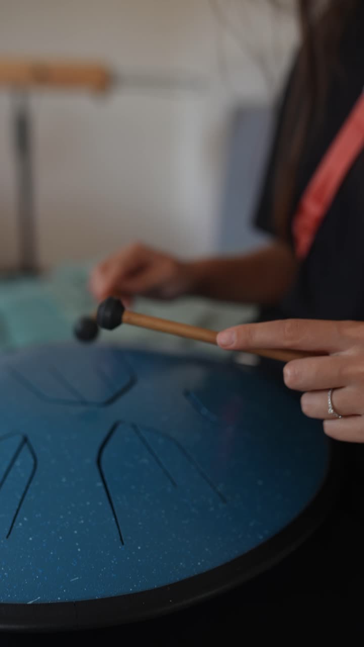 Woman playing a singing bowl