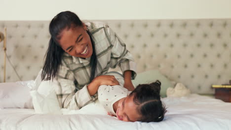 Pillow-fight,-bedroom-and-mother-tickling