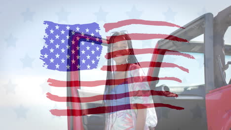 Animation-of-flag-of-usa-over-happy-african-american-woman-by-car-on-beach