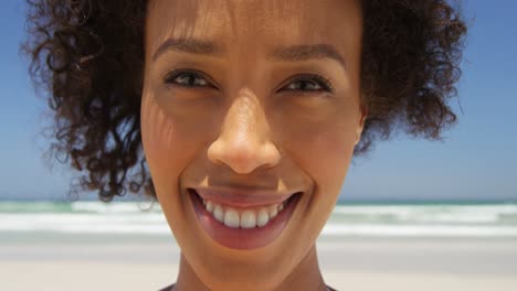 close-up of woman smiling at beach on a sunny day 4k
