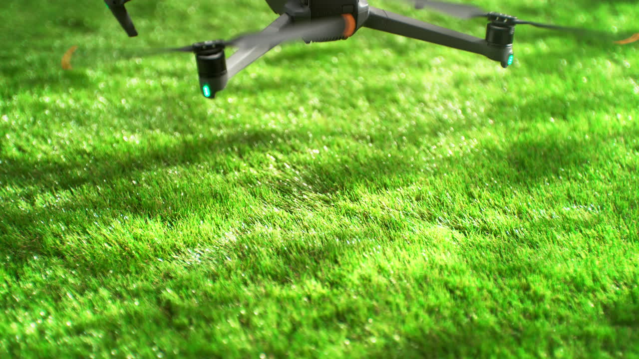 Drone Landing On A Lush Green Grass On A Sunny Day In Slow Motion