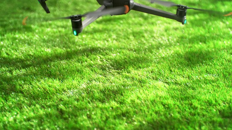Drone Landing On A Lush Green Grass On A Sunny Day In Slow Motion