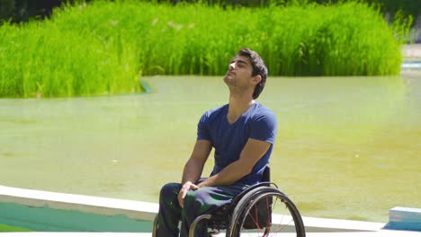 Cheerful-disabled-teenager-in-wheelchair.