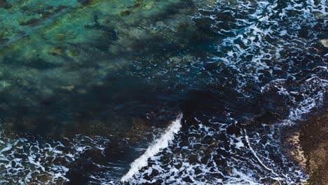 dirty sea pattern with algae under water waving and foaming on sandy beach in mediterranean coastline