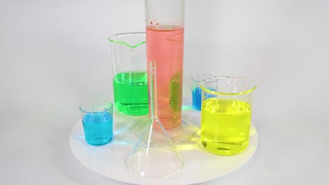 various colored liquids in laboratory beakers