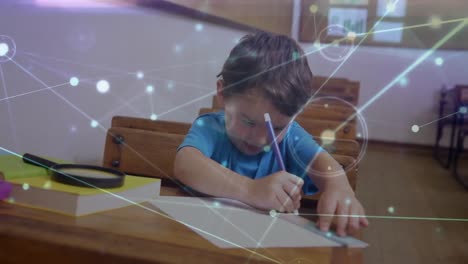 Network-of-connections-against-caucasian-boy-drawing-in-his-book-sitting-on-his-desk-in-class